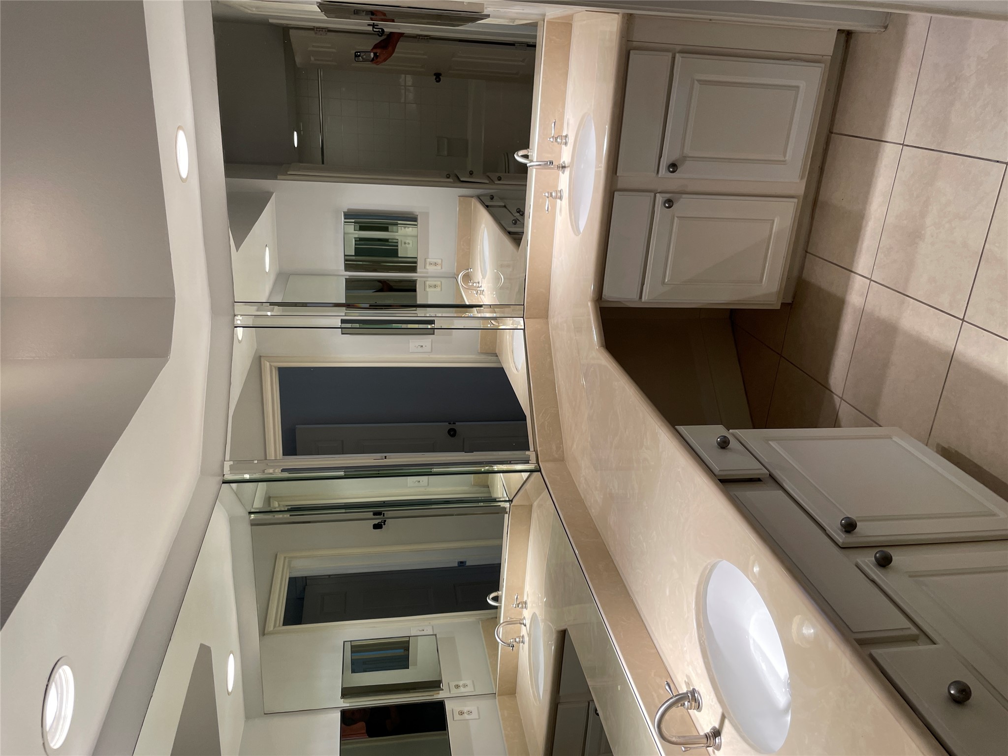 7701 Rialto Boulevard, Unit 822 Austin, TX 78735 - Photo 12 of 22 a bathroom with a sink and a mirror