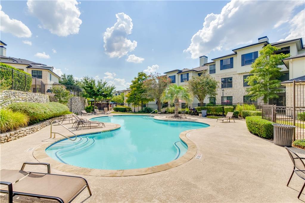 7701 Rialto Boulevard, Unit 822 Austin, TX 78735 - Photo 18 of 22 a view of a swimming pool with a patio