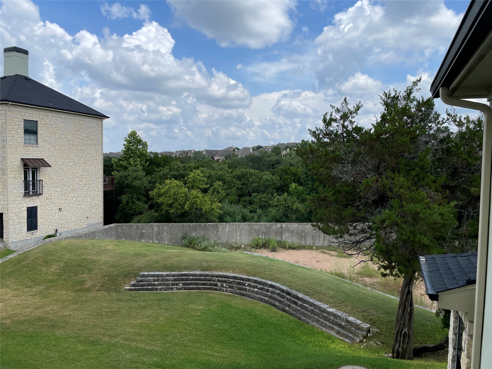 7701 Rialto Boulevard, Unit 822 Austin, TX 78735 - Photo 21 of 22 a view of a golf course with a garden