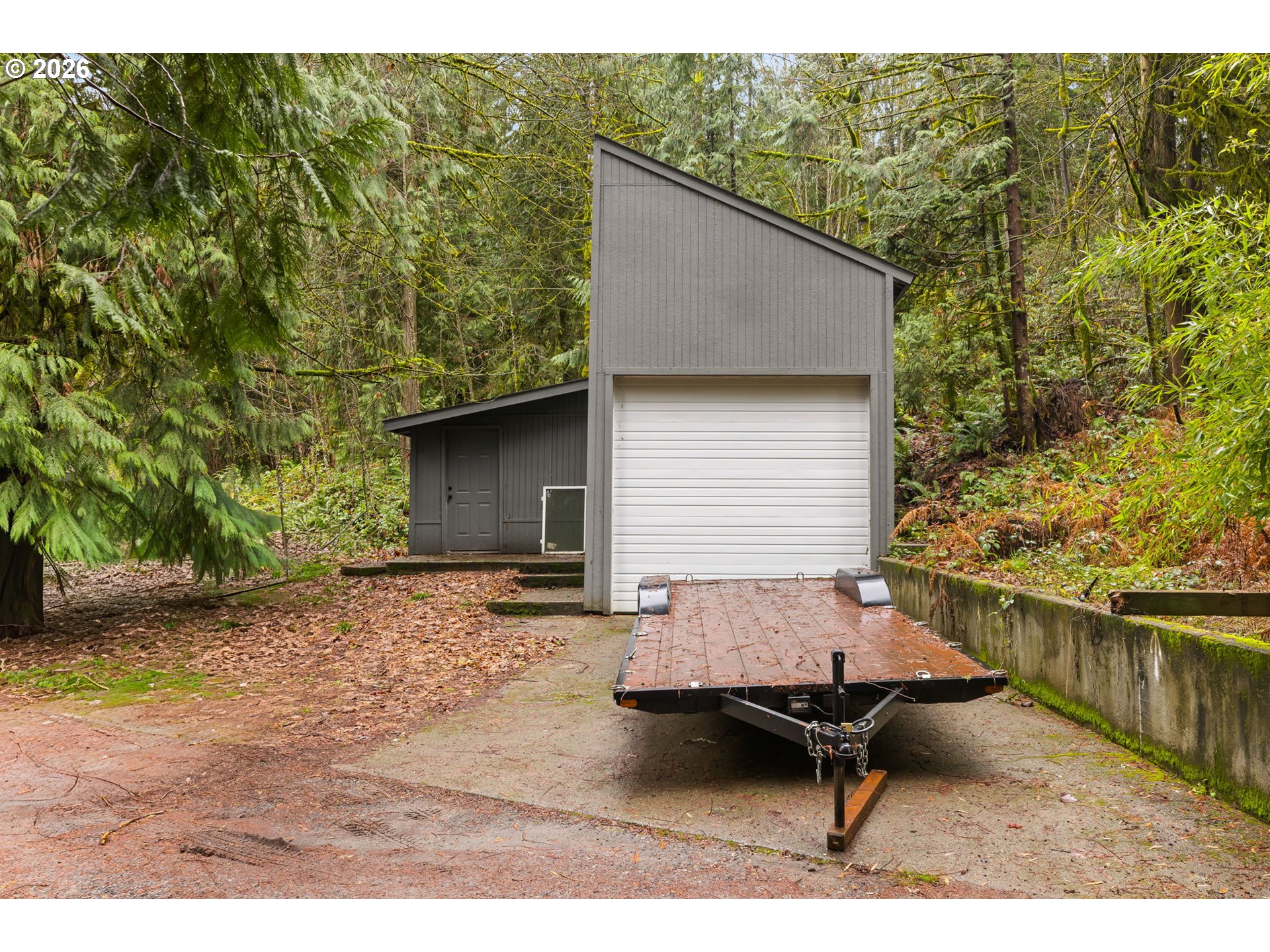 34221 Southeast Colorado Road Sandy, OR 97055 - Photo 41 of 48 a backyard of a house with barbeque oven table and chairs