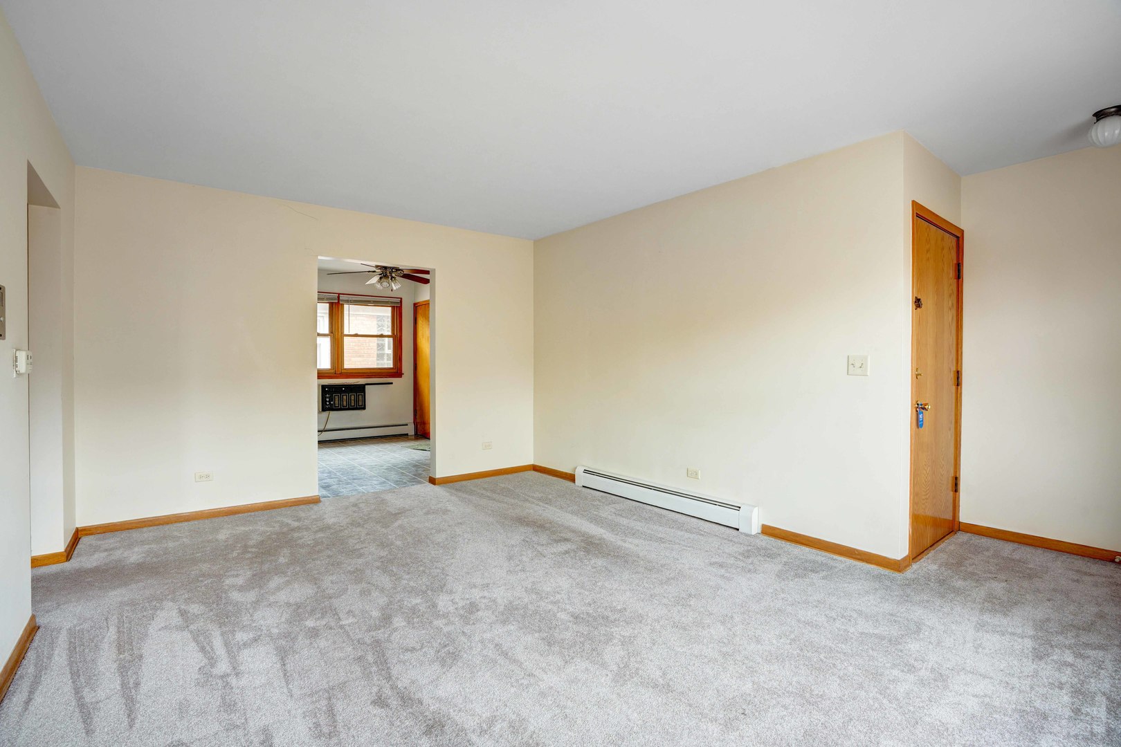 8444 West Gregory Street, Unit 3B Chicago, IL 60656 - Photo 5 of 9 an empty room with windows