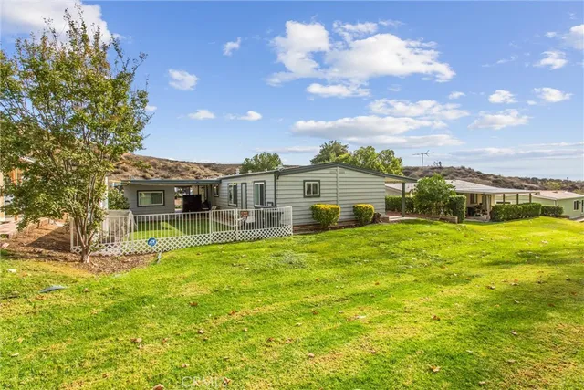 a view of a house with a big yard