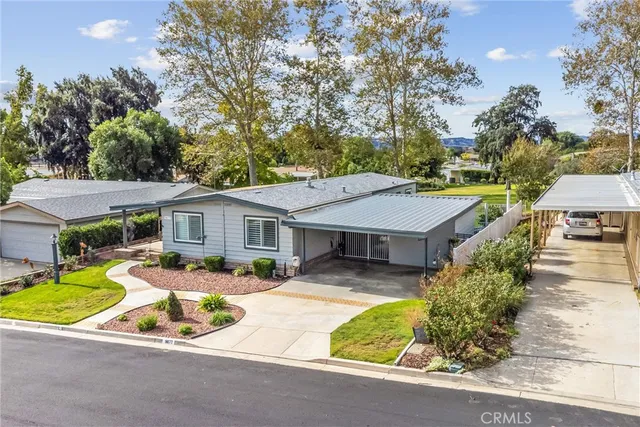 an aerial view of a house with swimming pool and porch