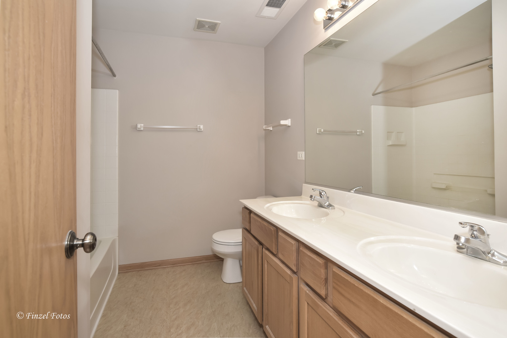 1931 South Cedar Lake Road Round Lake, IL 60073 - Photo 12 of 16 a bathroom with a sink toilet and shower