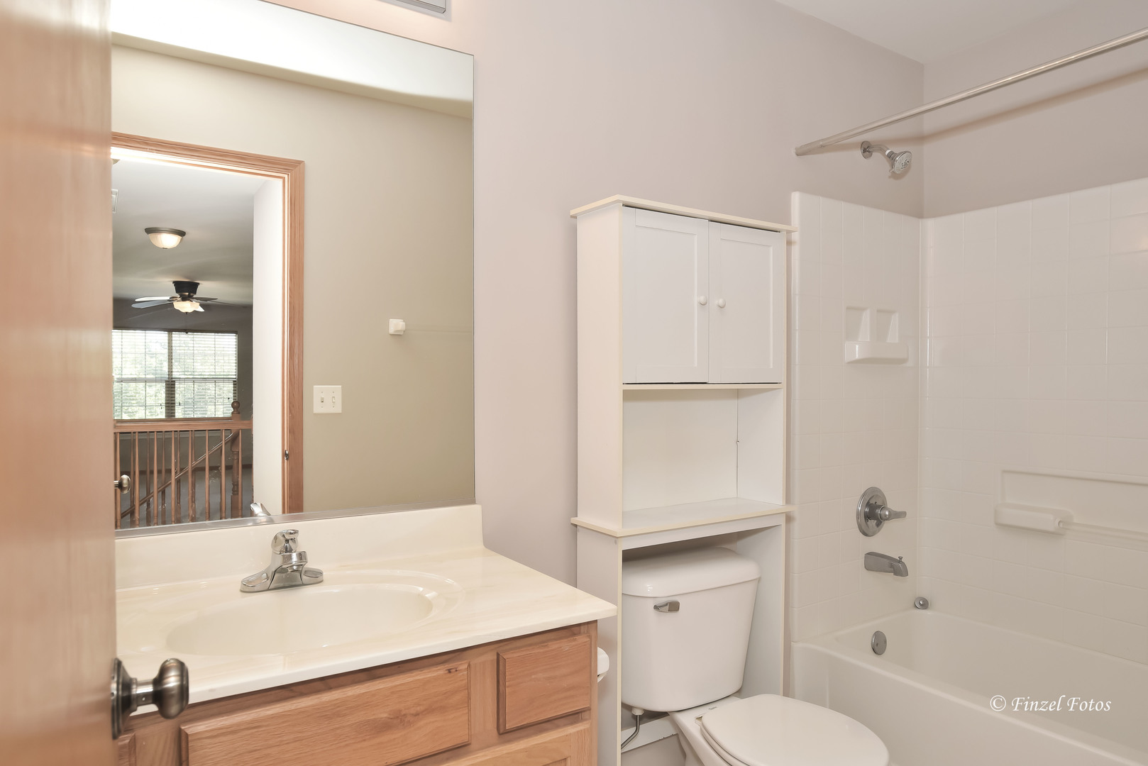 1931 South Cedar Lake Road Round Lake, IL 60073 - Photo 15 of 16 a bathroom with a sink toilet and shower