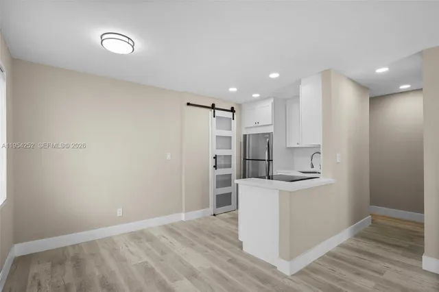a view of kitchen with wooden floor