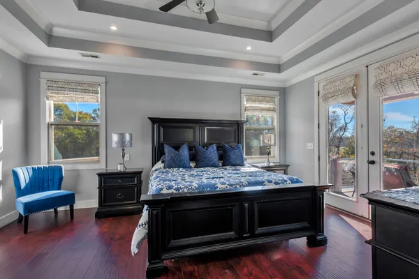 a bathroom with a granite countertop sink and a window