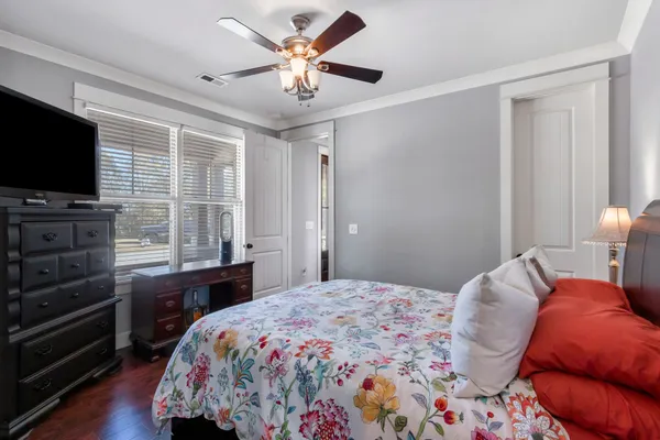 a bedroom with a bed and a walk in closet