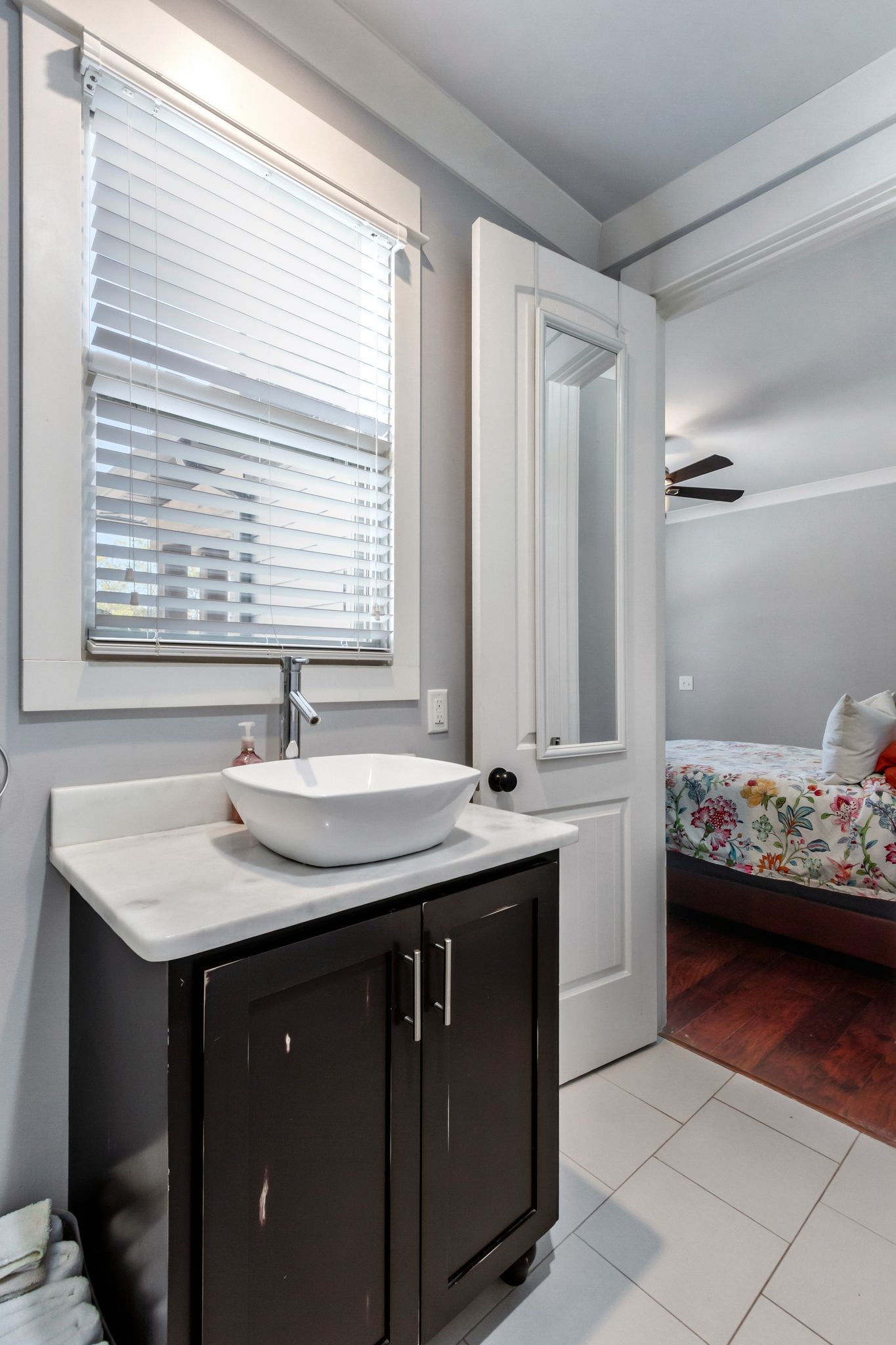 2886 Fly Road Santa Fe, TN 38482 - Photo 37 of 92 a bathroom with a granite countertop sink and a window