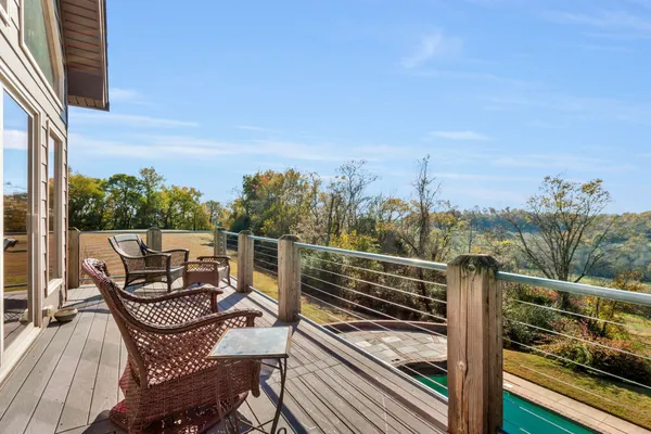 a view of a backyard with wooden fence