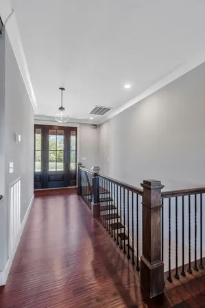 a kitchen with stainless steel appliances granite countertop a sink a stove and a wooden floors
