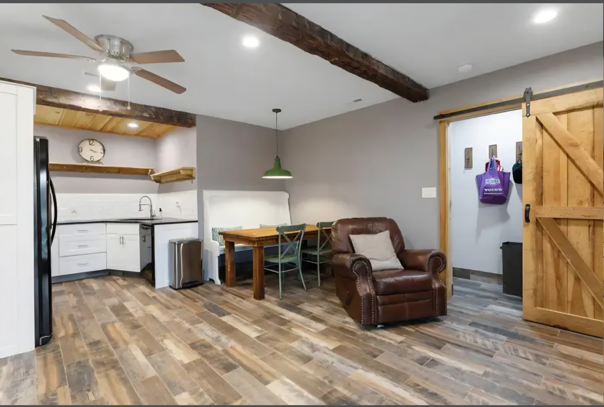 2886 Fly Road Santa Fe, TN 38482 - Photo 87 of 92 a living room with furniture a flat screen tv and kitchen view