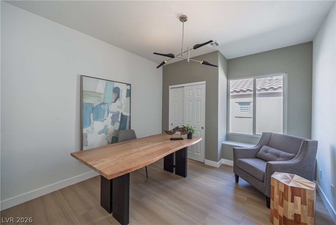 10982 Village Ridge Lane Las Vegas, NV 89135 - Photo 11 of 12 Elegant overhead lighting illuminates this well-lit home office, providing a productive atmosphere for work.