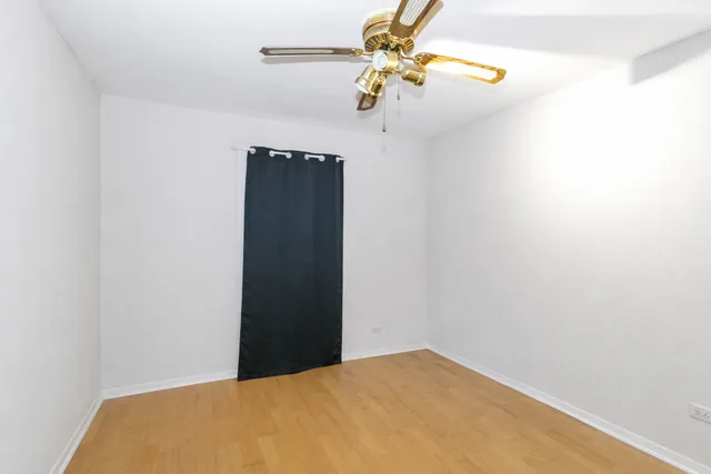 a view of a room with a hanging light