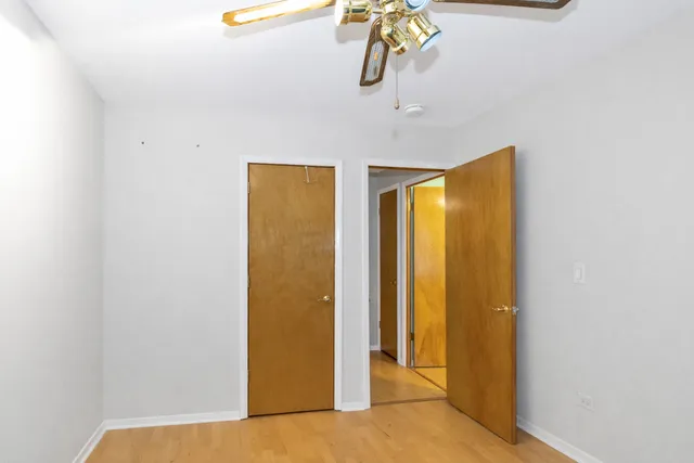 a view of entryway and hall with a door