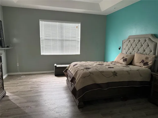 a bedroom with a bed and window