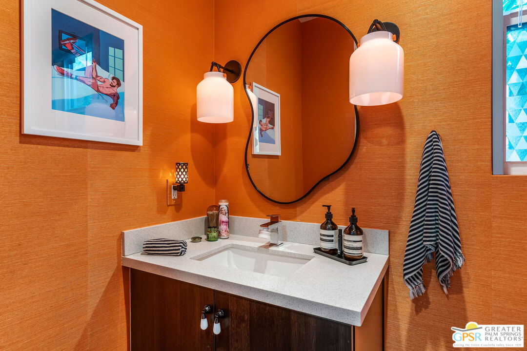482 Paragon Loop Palm Springs, CA 92262 - Photo 15 of 24 a bathroom with a sink and a mirror