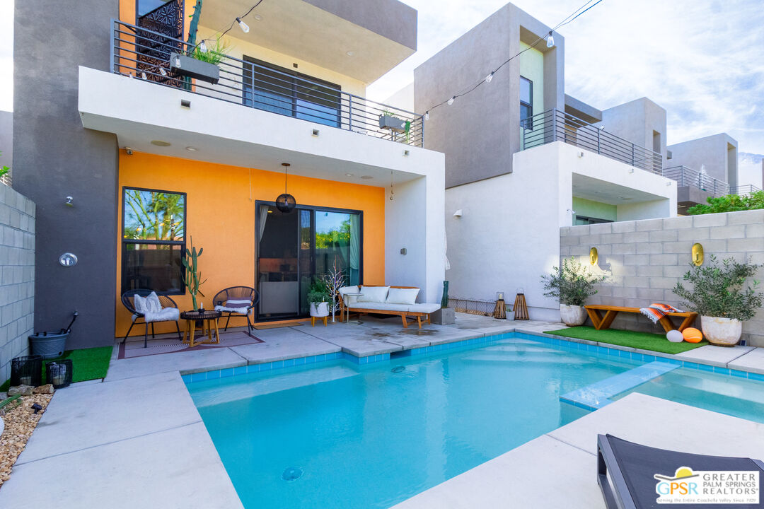 482 Paragon Loop Palm Springs, CA 92262 - Photo 20 of 24 an outdoor space with patio furniture and a fireplace