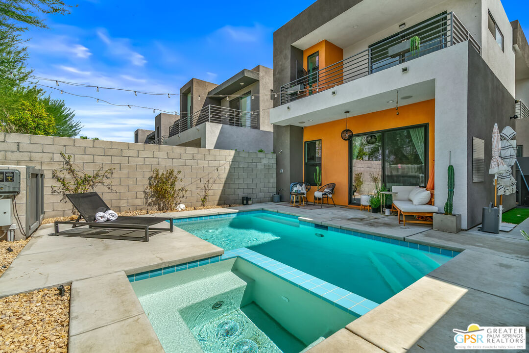 482 Paragon Loop Palm Springs, CA 92262 - Photo 2 of 24 a view of a building with many windows