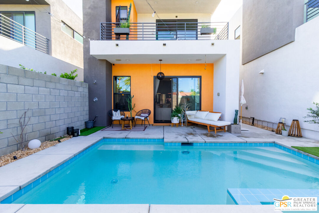 482 Paragon Loop Palm Springs, CA 92262 - Photo 21 of 24 a view of swimming pool with outdoor seating