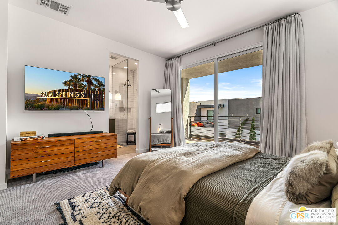 482 Paragon Loop Palm Springs, CA 92262 - Photo 7 of 24 a bedroom with a bed and a window