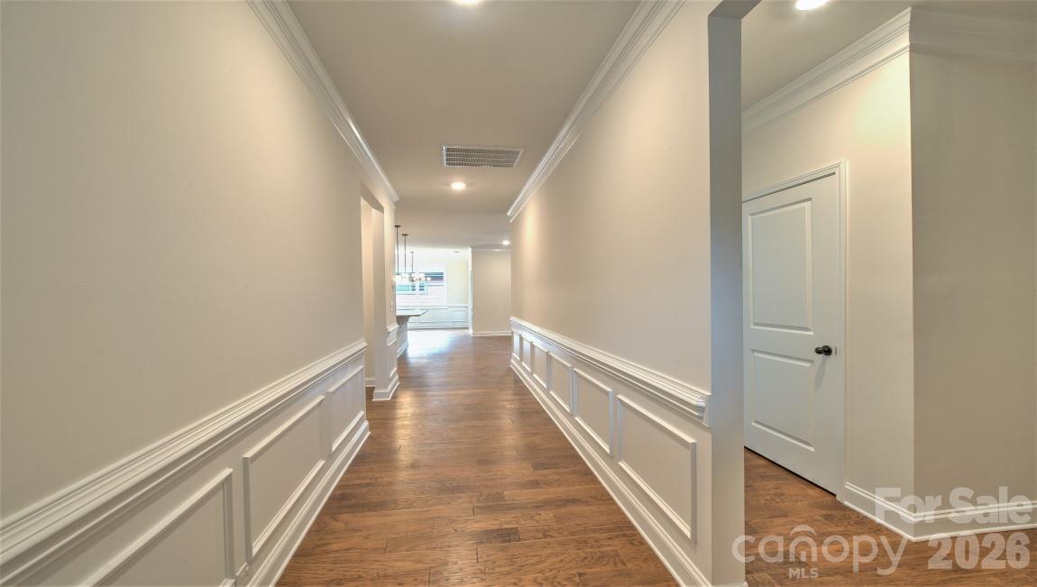 649 River Btm Road Fletcher, NC 28732 - Photo 7 of 40 a view of a hallway with wooden floor and staircase