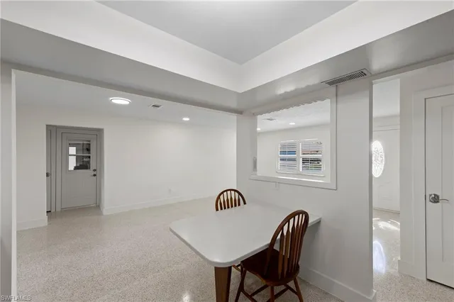 a kitchen with granite countertop a sink cabinets and stainless steel appliances