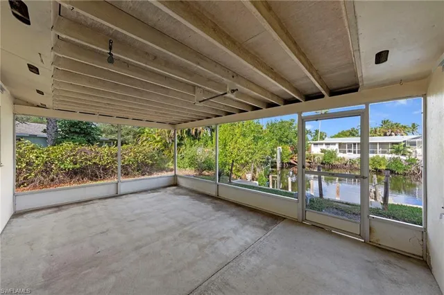 an aerial view of a house with a swimming pool outdoor seating and yard