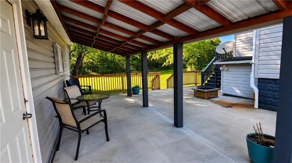 671 Old Rte 8 Harrisville, PA 16038 - Photo 8 of 49 a view of a porch with furniture and a yard