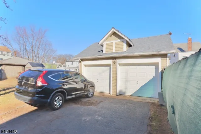 a view of a car in front of a house
