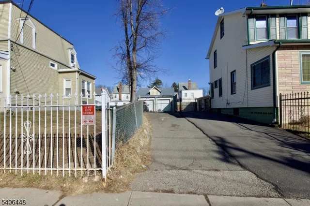 a view of a brick house with many windows