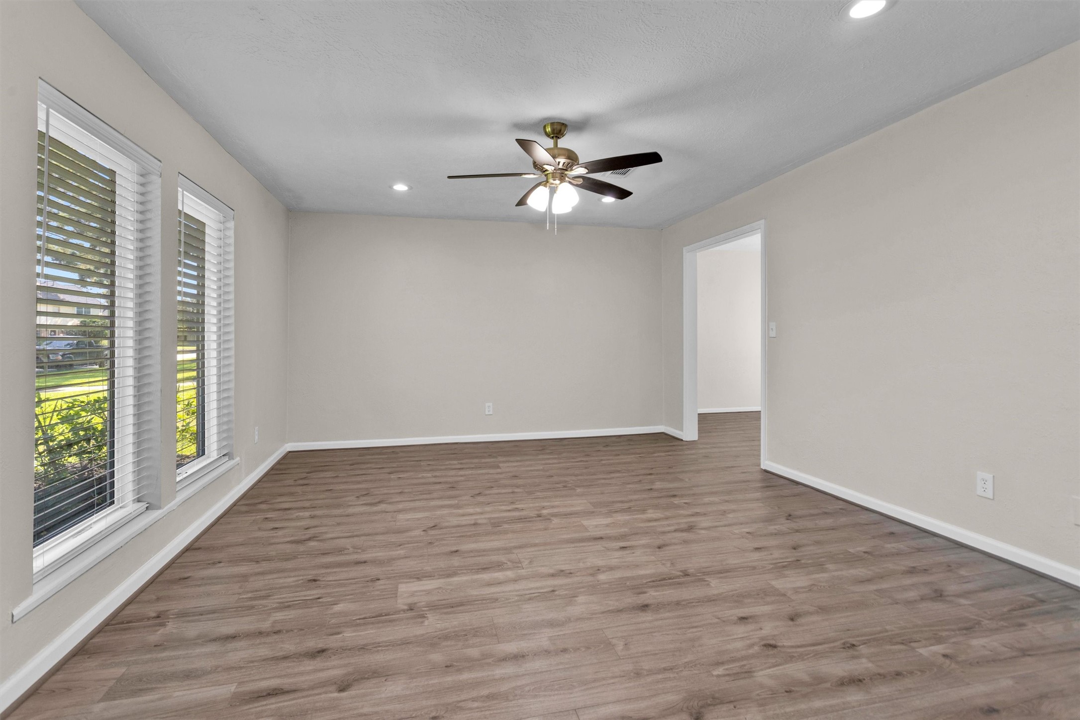 9115 Godstone Lane Spring, TX 77379 - Photo 9 of 46 A reverse shot of the formal living room. It leads into the formal dining.