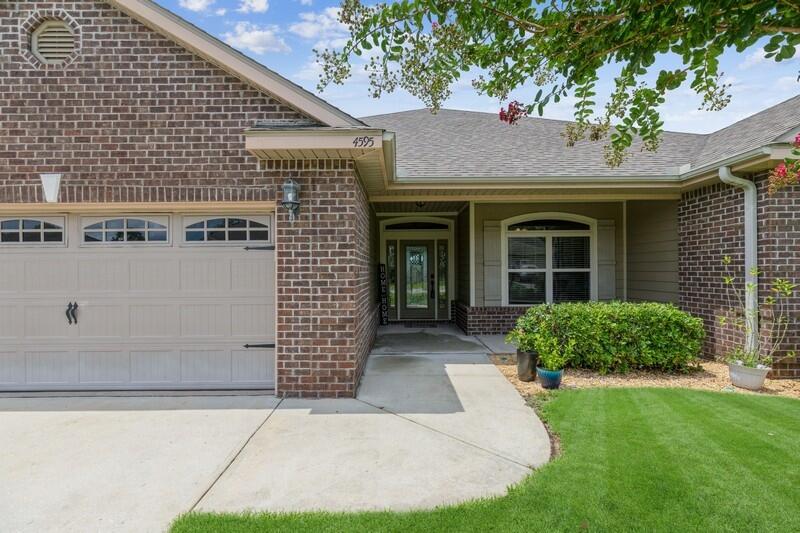 4595 Hermosa Road Crestview, FL 32539 - Photo 1 of 35 a front view of a house with garden