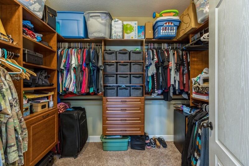 4595 Hermosa Road Crestview, FL 32539 - Photo 22 of 35 a view of walk in closet with clothes and shoes