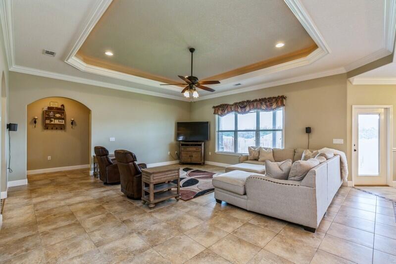 4595 Hermosa Road Crestview, FL 32539 - Photo 7 of 35 a living room with furniture and a fireplace