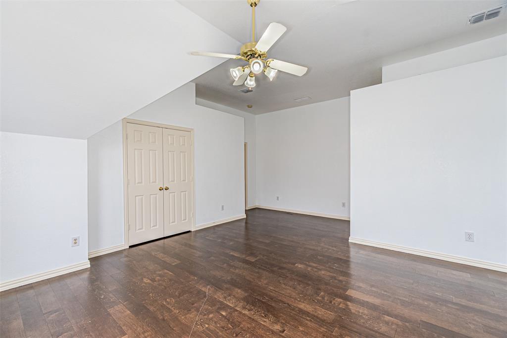 1907 New Haven Road Grapevine, TX 76051 - Photo 17 of 34 a view of an empty room with wooden floor
