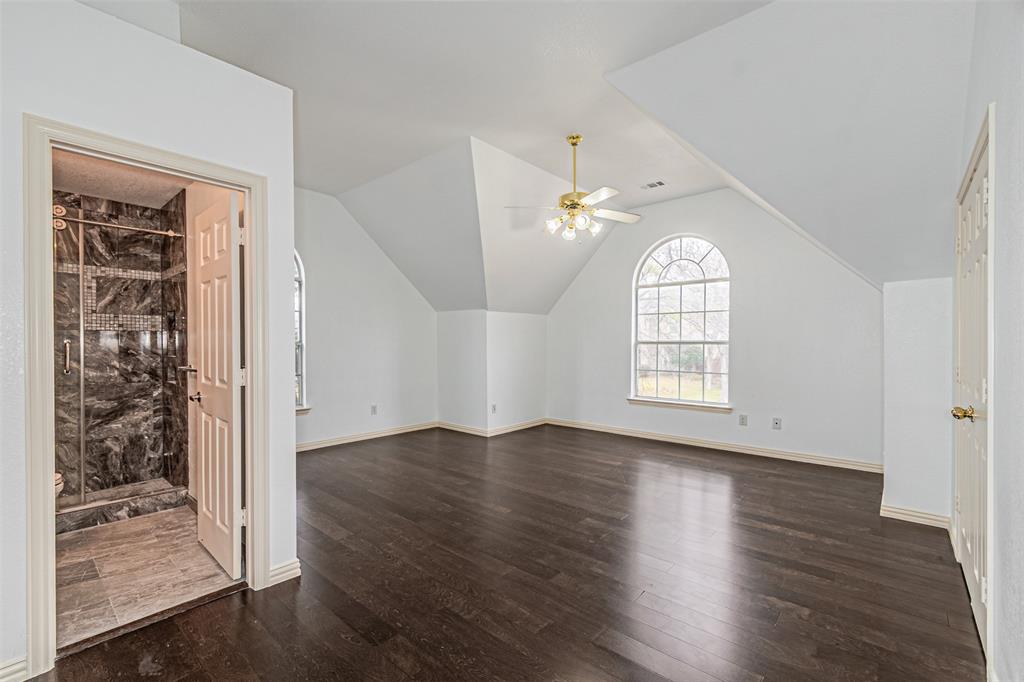 1907 New Haven Road Grapevine, TX 76051 - Photo 22 of 34 an empty room with wooden floor cabinet and windows