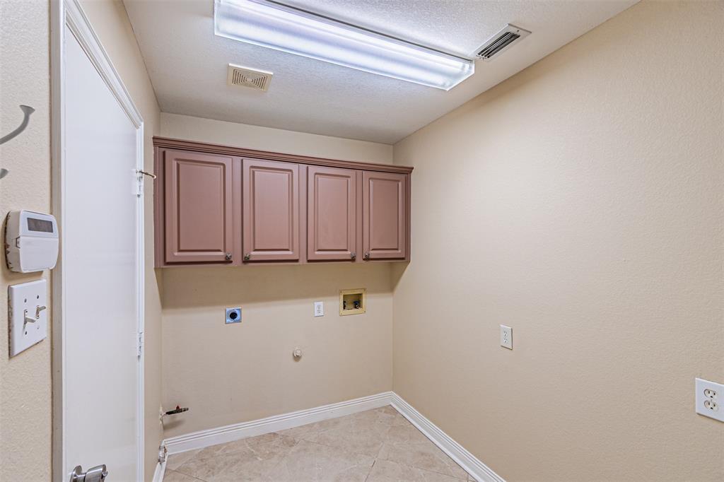 1907 New Haven Road Grapevine, TX 76051 - Photo 30 of 34 a view of storage and utility room with racks on the wall