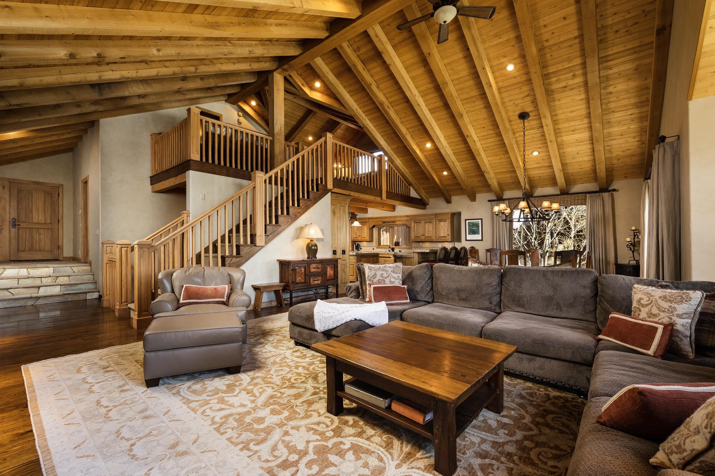 285 Juniper Road Mammoth Lakes, CA 93546 - Photo 11 of 38 a living room with furniture and a chandelier