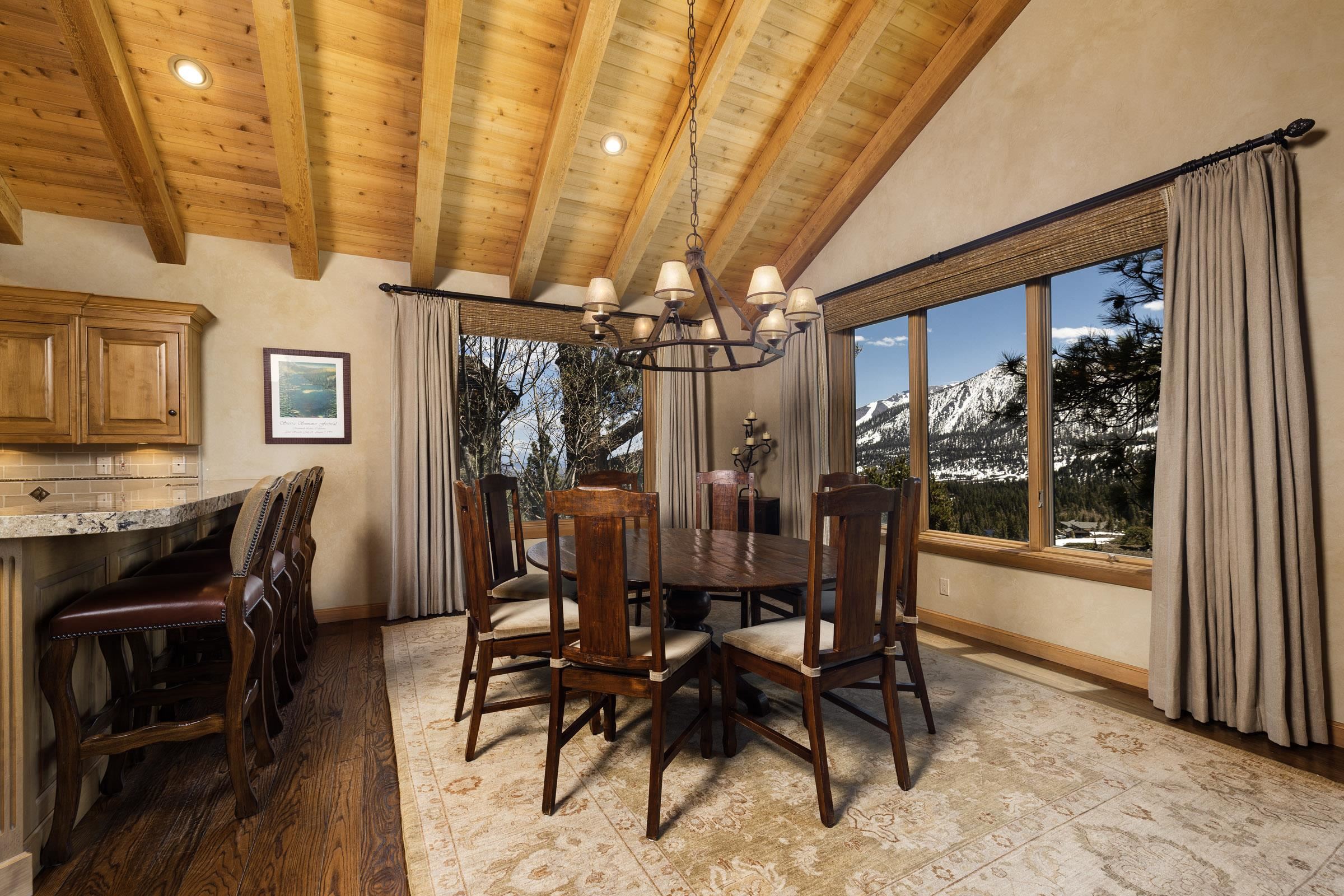285 Juniper Road Mammoth Lakes, CA 93546 - Photo 12 of 38 a view of a dining room with furniture and chandelier