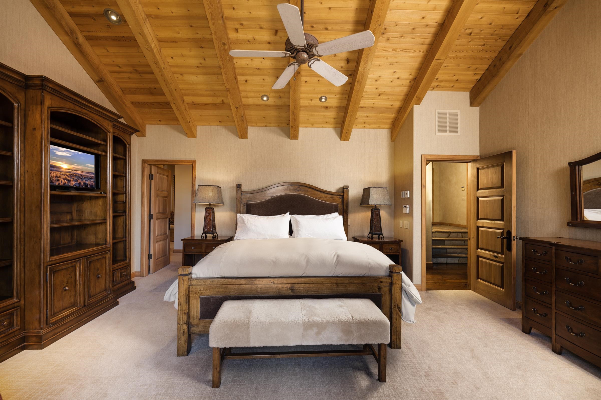 285 Juniper Road Mammoth Lakes, CA 93546 - Photo 17 of 38 a bedroom with a bed and a walk in closet