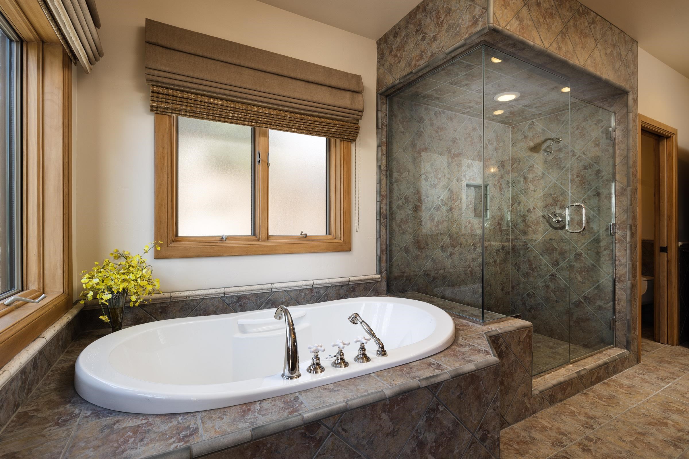 285 Juniper Road Mammoth Lakes, CA 93546 - Photo 19 of 38 a bath tub sitting in a bathroom next to a window