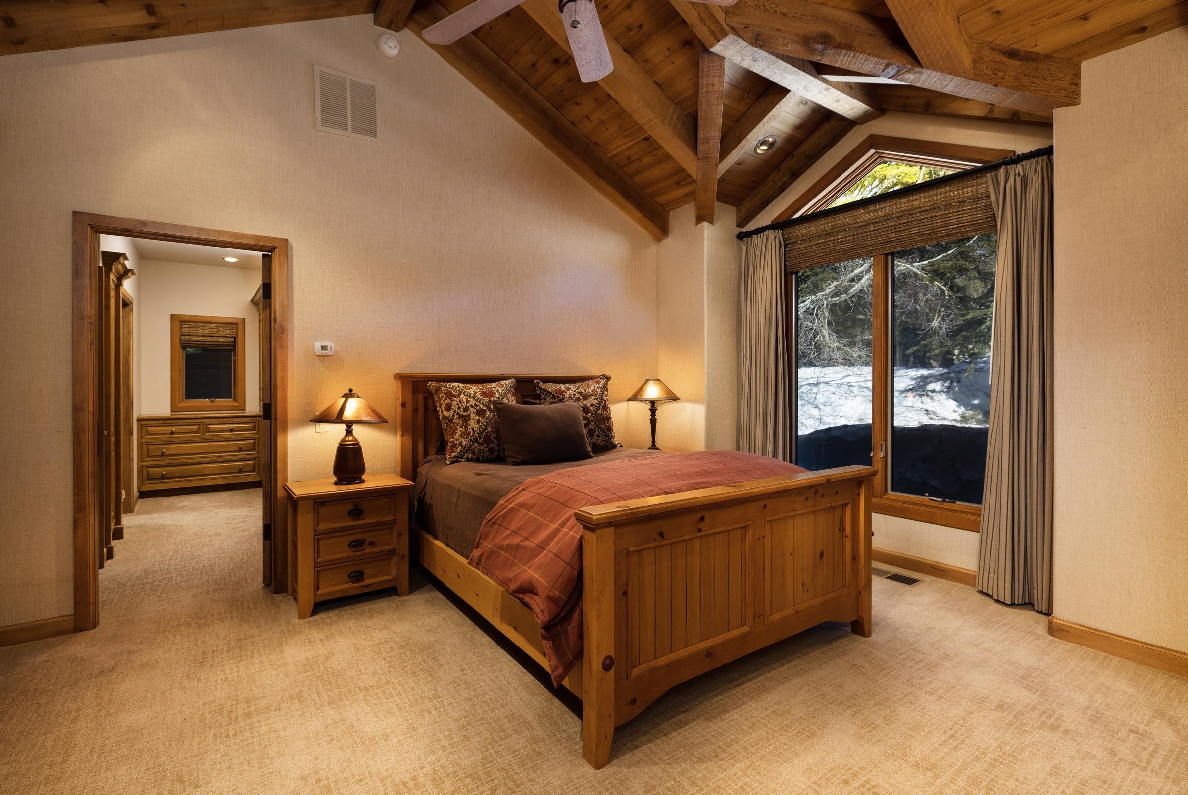 285 Juniper Road Mammoth Lakes, CA 93546 - Photo 21 of 38 a bed sitting in a bedroom next to a window