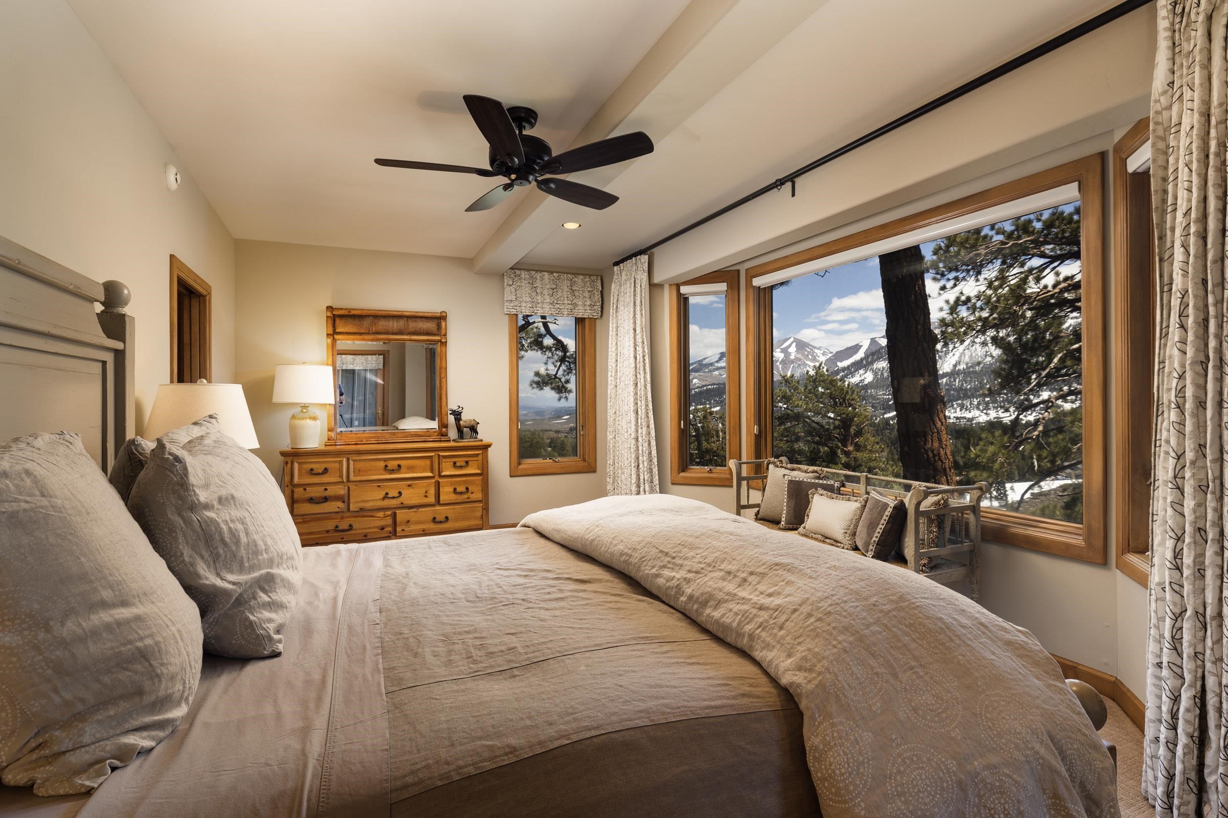 285 Juniper Road Mammoth Lakes, CA 93546 - Photo 24 of 38 a large bedroom with a large bed and a large window