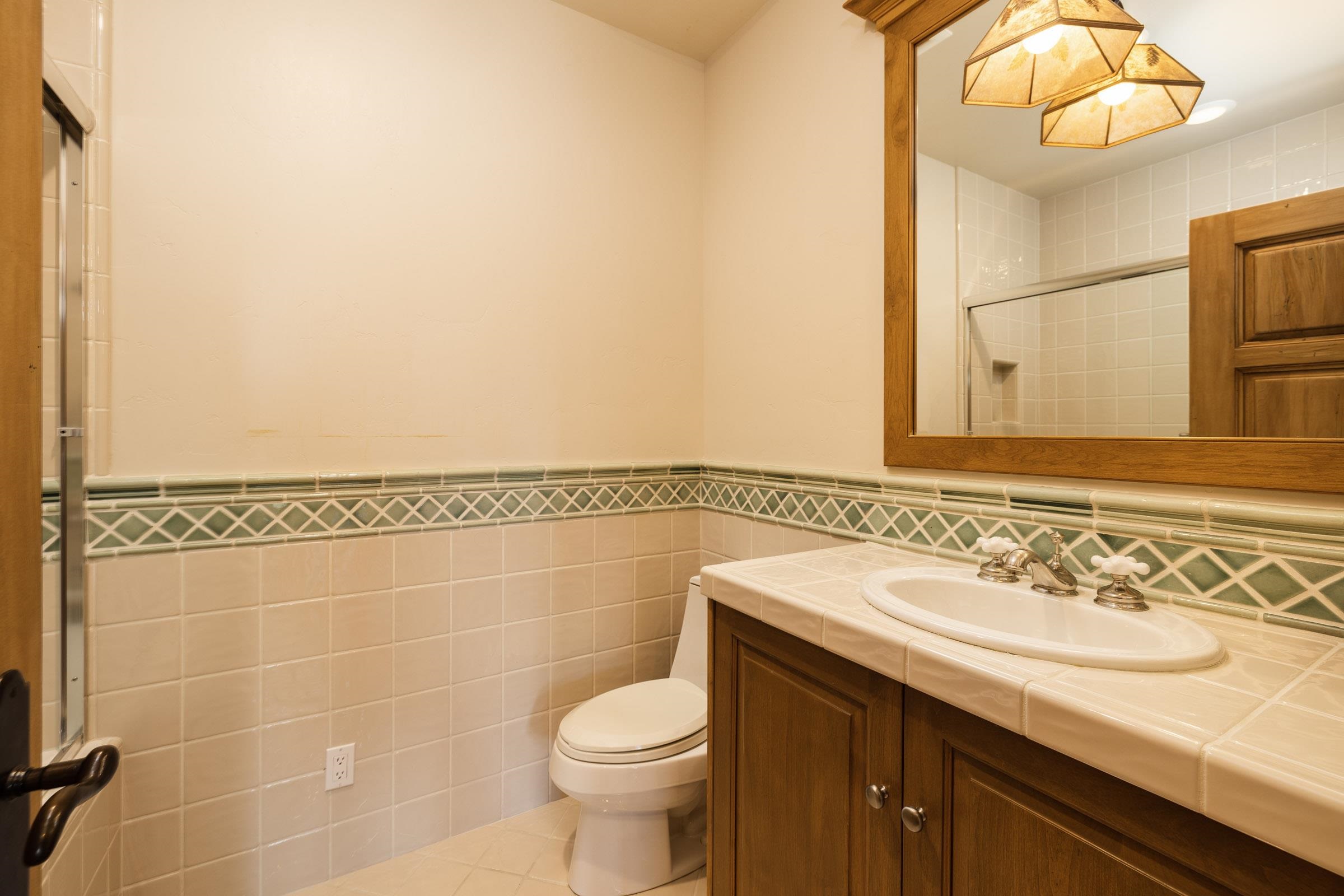 285 Juniper Road Mammoth Lakes, CA 93546 - Photo 32 of 38 a bathroom with a sink a toilet and shower