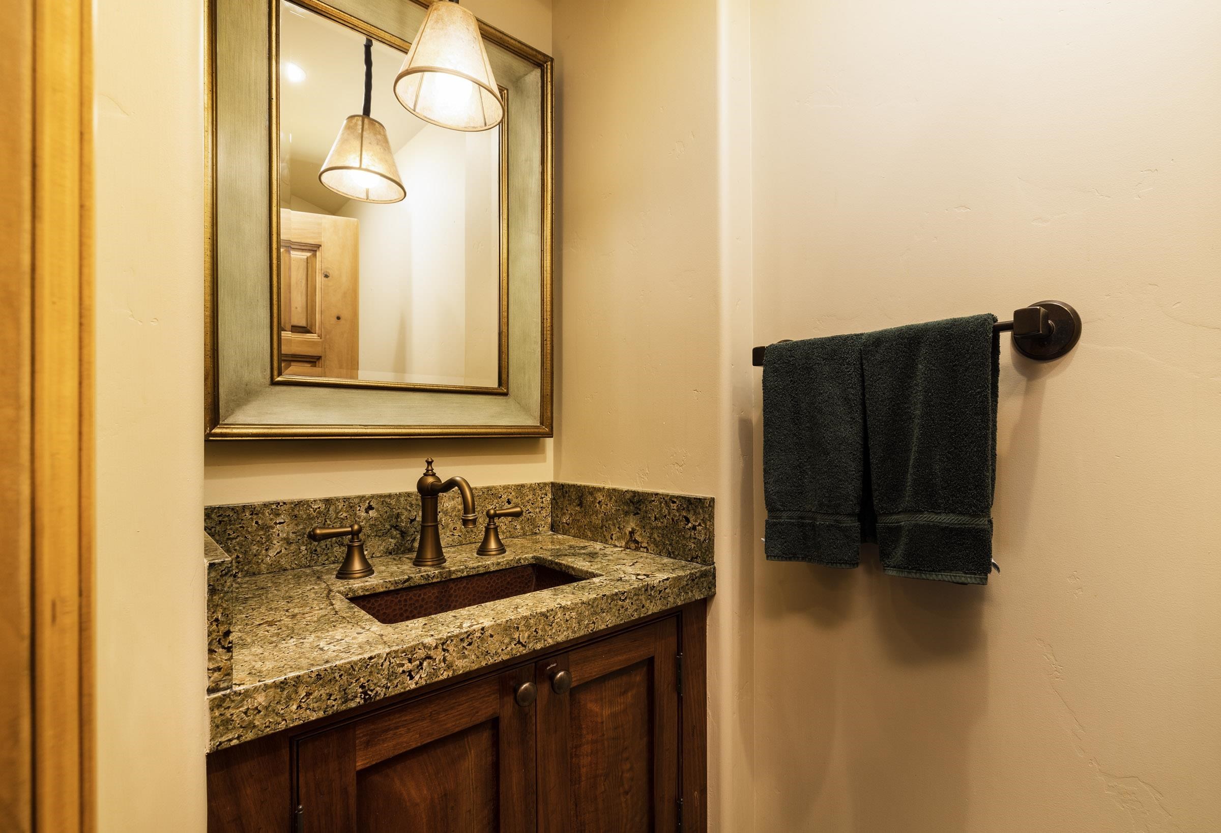 285 Juniper Road Mammoth Lakes, CA 93546 - Photo 34 of 38 a bathroom with a granite countertop sink and a mirror