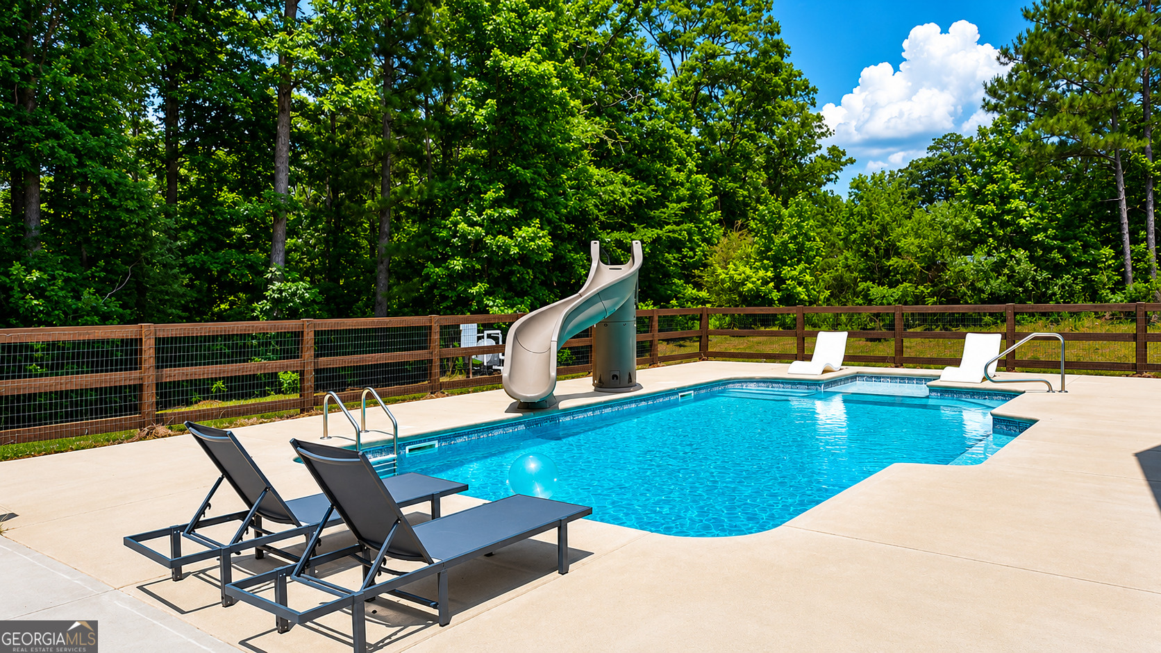 89 Claire Road Forsyth, GA 31029 - Photo 34 of 40 a view of a swimming pool with a lounge chair