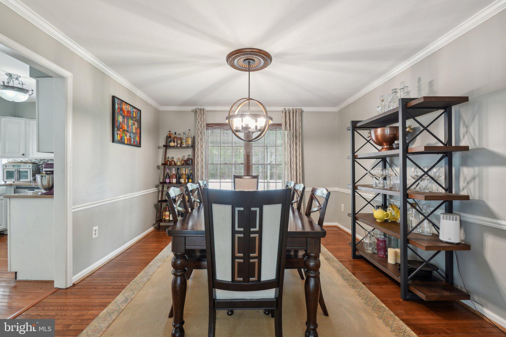 10604 Cannonview Court Fort Washington, MD 20744 - Photo 16 of 50 a view of a dining room with furniture and chandelier