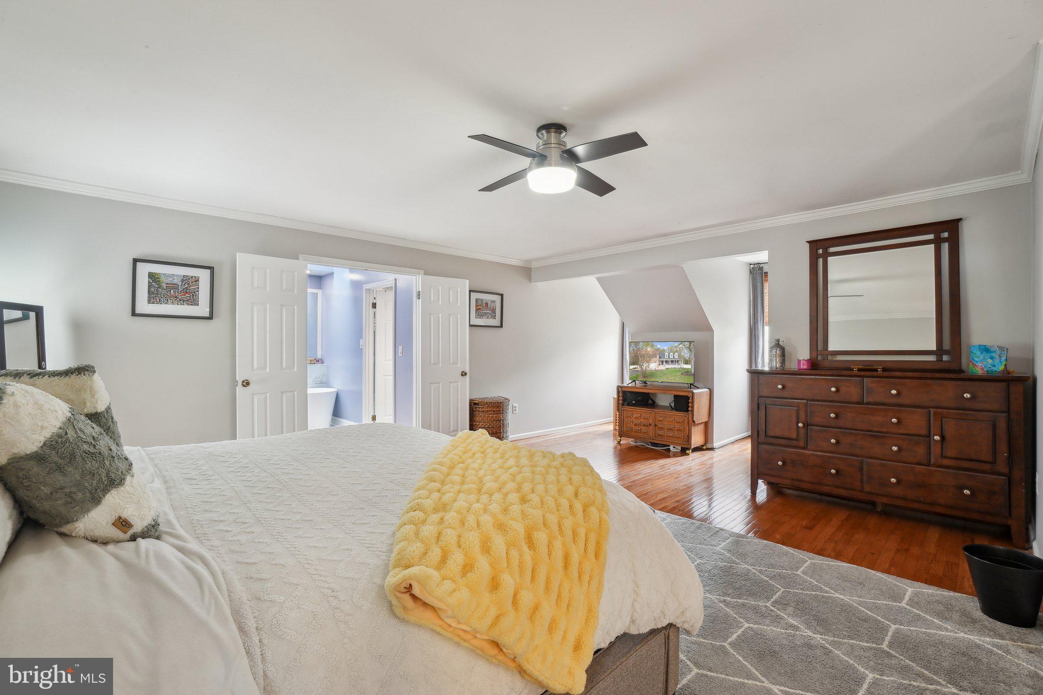 10604 Cannonview Court Fort Washington, MD 20744 - Photo 18 of 50 a bedroom with a bed and wooden floor