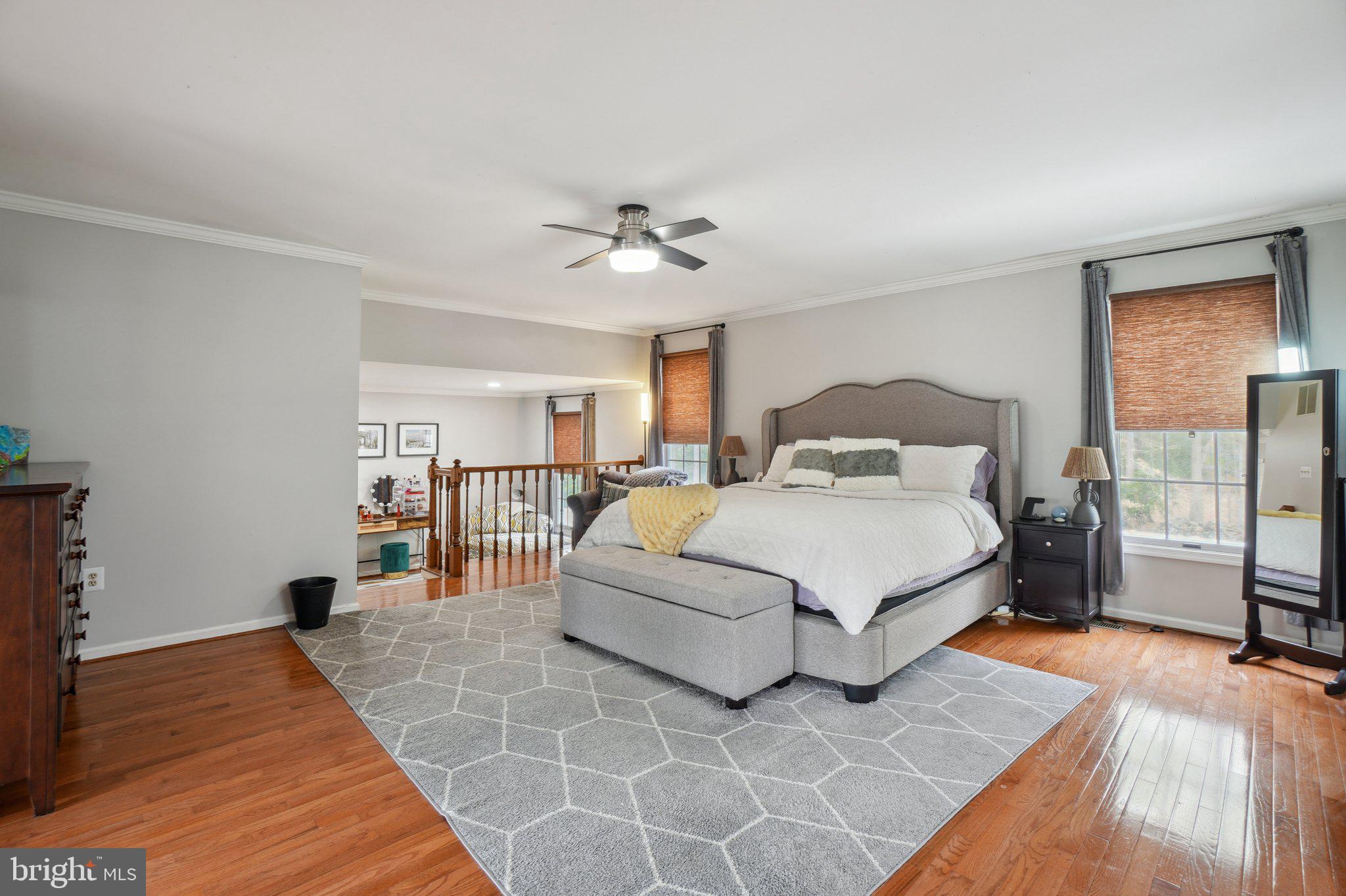 10604 Cannonview Court Fort Washington, MD 20744 - Photo 19 of 50 a bedroom with a large bed and a chandelier